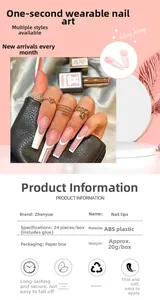 Macro view of French press-on nail kit featuring white tips and sparkling rhinestone accents