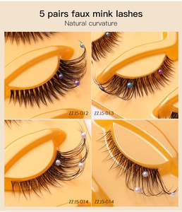 Macro shot of 5 pairs faux mink eyelashes with pearls and transparent bands for cat-eye makeup