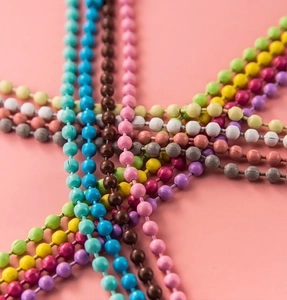 Close-up of colorful metal ball chains for DIY jewelry making and bag charms