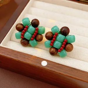 Ethnic style flower cluster earrings with green resin and brown wood beads in jewelry box