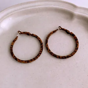Maillard brown leopard print round hoop earrings with soft flocked texture for women