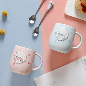 Pink and blue ceramic cat mugs with matching paw spoons and lids for coffee and tea