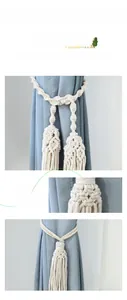 Close-up of hand-woven cotton curtain tieback featuring intricate tassels and macrame texture