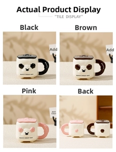 Detail view of colorful ceramic dog mugs with lids and 'Happy Every Day' text print