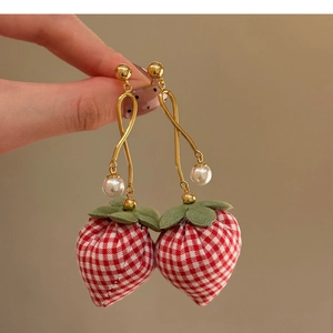 Detail of strawberry drop earrings with red gingham fabric and elegant white pearls