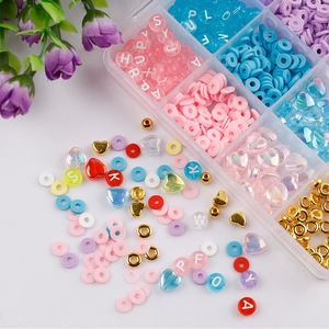DIY heart bead set in multi-grid organizer with colorful clay discs and charms