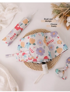 Floral patterned automatic folding umbrella with a matching storage pouch on a rustic mat
