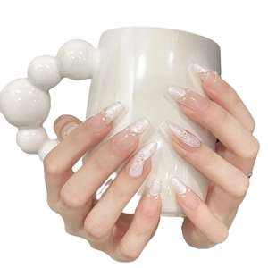 Elegant long trapezoid press-on nails with pearl accents and golden wire details