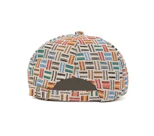 Rear view of colorful jacquard newsboy cap showing woven pattern and bronze metal buckle
