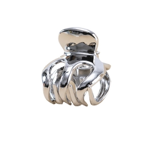 Polished silver metal hair claw clip for women featuring a minimalist sleek design