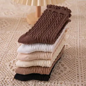 Multi-color knit mid-calf socks with cable patterns and wavy ruffled edges for women