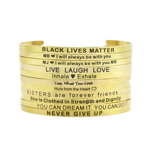 Stack of 4mm gold stainless steel open cuff bracelets with inspirational engraved quotes