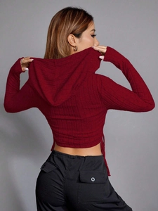 Slim fit burgundy long sleeve cropped hoodie for women seen from a back view portrait