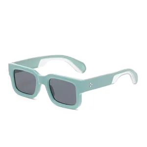 Chic mint green square thick frame sunglasses with metal rivet details on white background