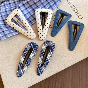 Set di fermagli per capelli in tessuto con stelle e forme geometriche in stile minimalista