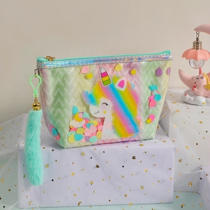Detail of light green unicorn makeup bag with colorful sequins and plush tail charm