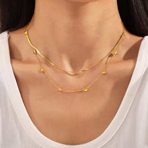 Double-layered 18K gold titanium steel necklace with heart pendant and sleek snake chain