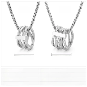 Detailed comparison of two layered stainless steel pendant necklaces with crystal insets