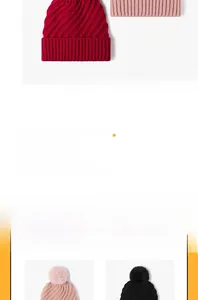 Detailed macro view of the thick knit pattern and fluffy faux fur pom-pom on top