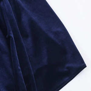 Close-up of deep blue velvet fabric showing luxurious texture and elegant drape