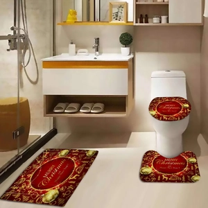 Three-piece festive red and gold Christmas bathroom mat set with Merry Christmas text