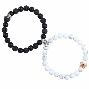 Detail of magnetic stone bracelets for couples with crown charms and 8mm crystal beads
