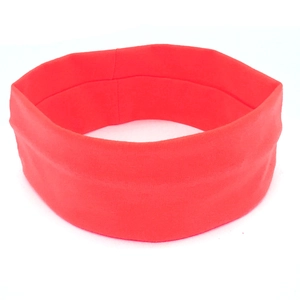 Close-up of a vibrant red elastic yoga headband featuring soft knit fabric and wide design