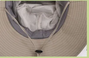 Detail of khaki sun hat featuring breathable mesh lining and adjustable windproof chin strap