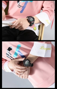 Detailed view of men's digital sports watch with black resin case and waterproof display
