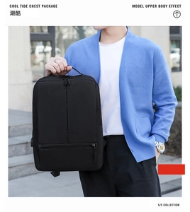 Close-up of black waterproof business backpack with USB port and ergonomic handle detail