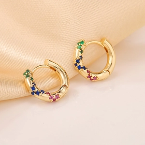 Minimalist gold hoop earrings with micro-paved multicolor gemstones and twisted design