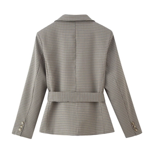 Detail of beige plaid blazer back with matching waist belt and button cuffs decoration