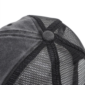 Macro view of washed cotton fabric and mesh texture on the trucker hat crown