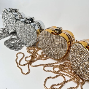 Detailed view of luxury heart-shaped evening clutch bags with sparkling rhinestones