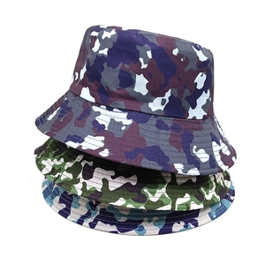 Three camouflage bucket hats in purple, green, and blue displayed on a plain background