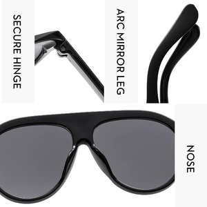 Detail view of secure hinges, arc mirror legs, and nose pads of oversized black sunglasses