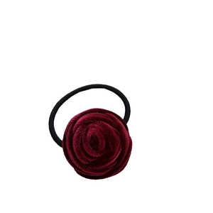 Handmade deep red velvet rose flower hair tie with elastic band on white background