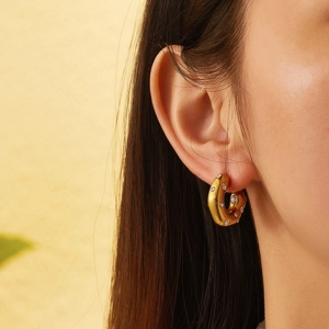 18k gold plated stainless steel hoop earrings with colorful crystals on model