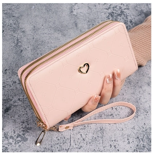Pink PU leather wallet with embossed geometric texture, double zipper, and heart charm