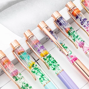 Elegant liquid herbarium ballpoint pens with dried flowers and colorful metal barrels