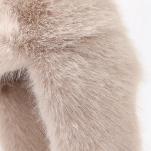 Close-up of soft faux fox fur material in champagne gold for winter trapper hats