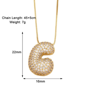 Detailed view of gold letter G pendant with white zircon stones and size specifications