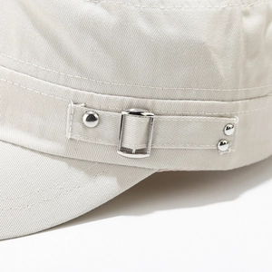 Detailed close-up of beige twill cotton military cap with metal buckle and stitch detail