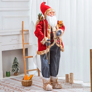 Standing Santa Claus figurine with red plush coat and teddy bear for Christmas home decor