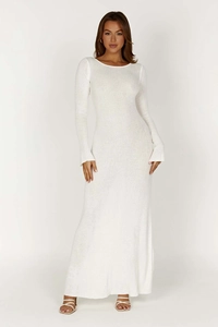 Close-up detail of white long sleeve knitted maxi dress with a slim fit silhouette