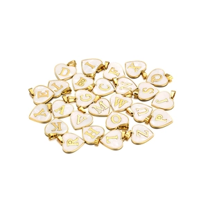 Full set of 26 heart-shaped alphabet pendants with golden edges and shell finish