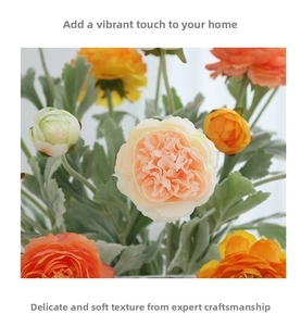 Detailed view of artificial buttercup silk flowers with layered orange and yellow petals