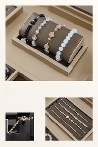 Beige leather jewelry display set with bracelet rolls, ring stand and storage tray