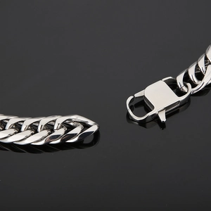 Polished stainless steel double-weave cuban chain bracelet with a square clasp closure