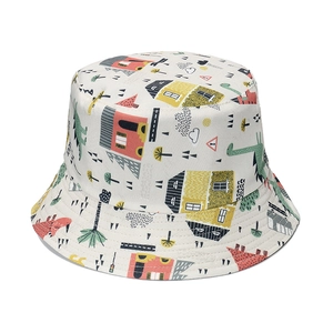 Kids cream bucket hat with colorful dinosaur and house prints for sun protection